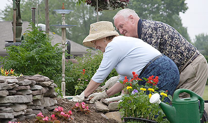 Residents planting a garden on their property