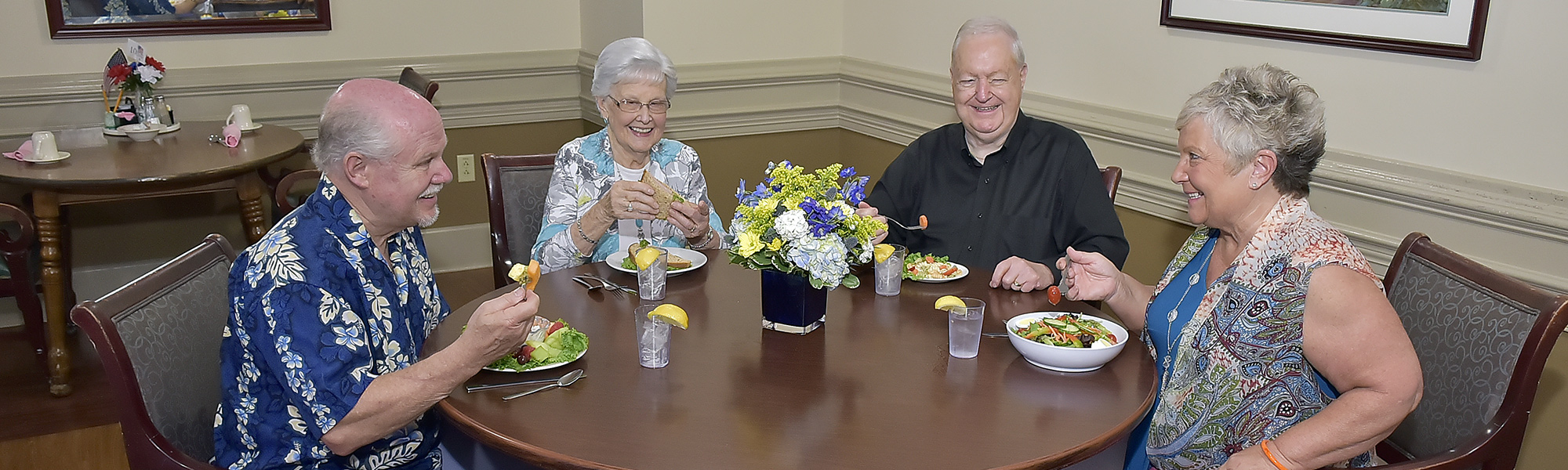 Two Senior Couples Dining