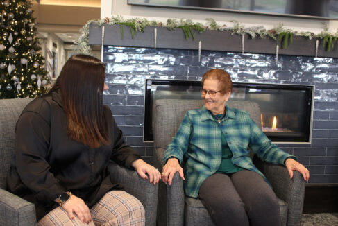 Women in front of fireplace