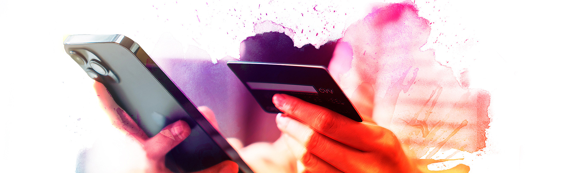 Close up of cell phone with a hand holding a credit card to make a donation