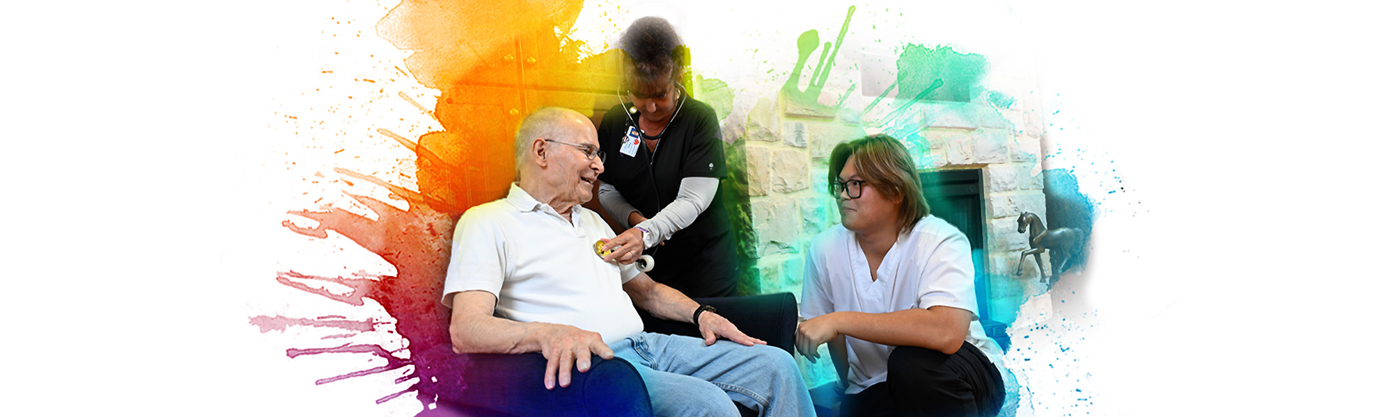 A female and a male nurse check the heartbeat of a seated patient