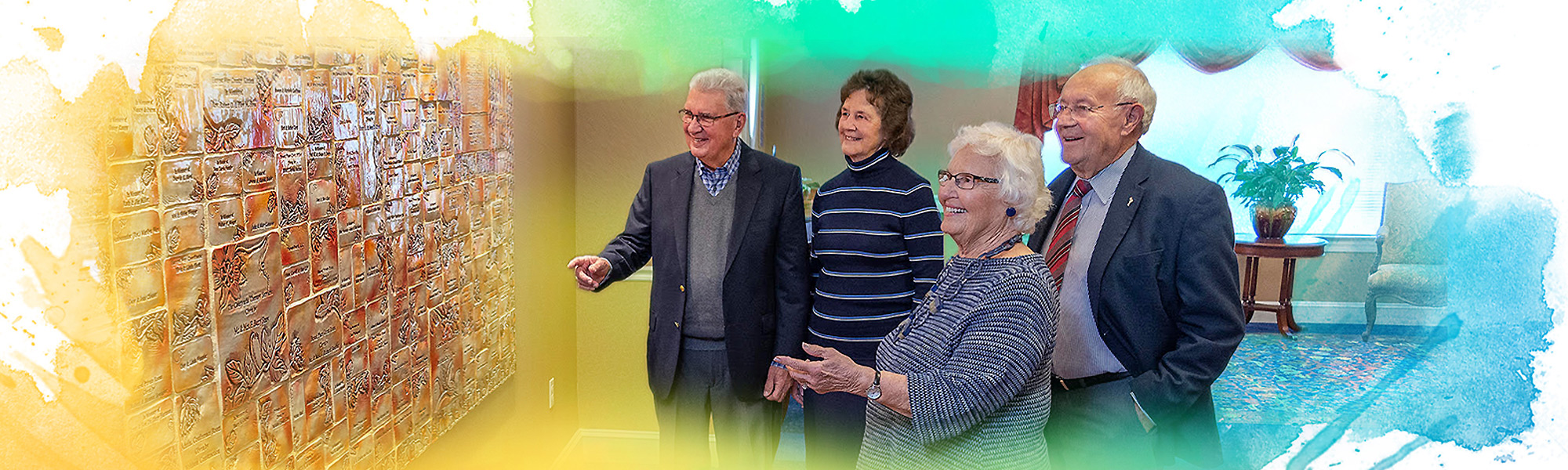 A group of donors admiring the Giving Wall