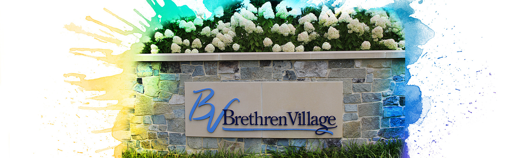 The Brethren Village sign on the stone wall at the intersection of Lititz Pike and Airport Road
