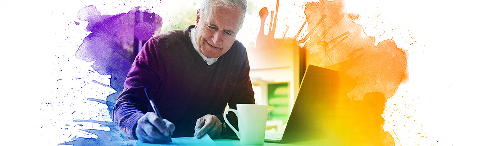 Elderly male making a donation by writing a check