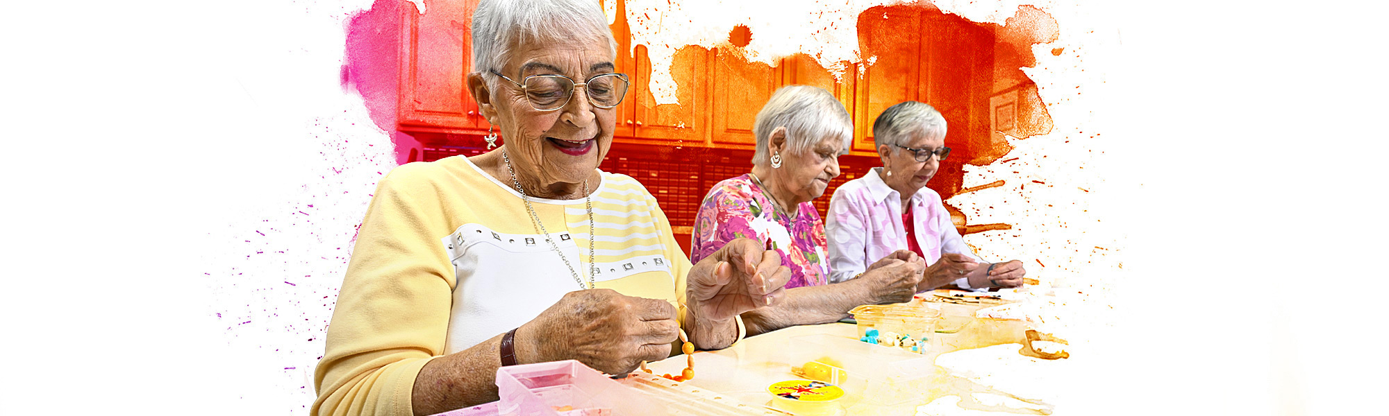 Residents socialize while making jewelry