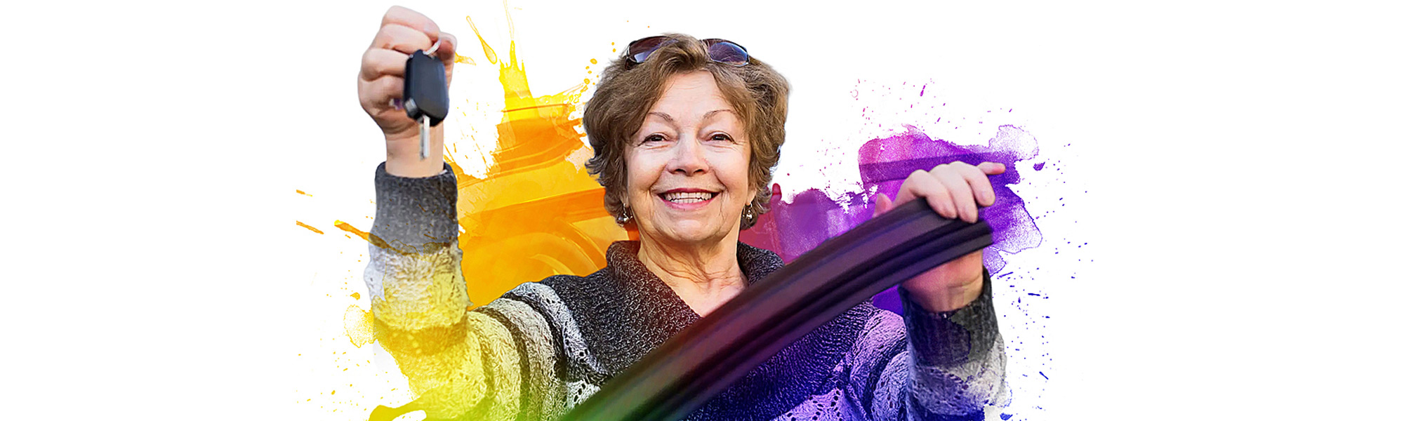 Female stepping out of her car and holding up her keys to donate a vehicle