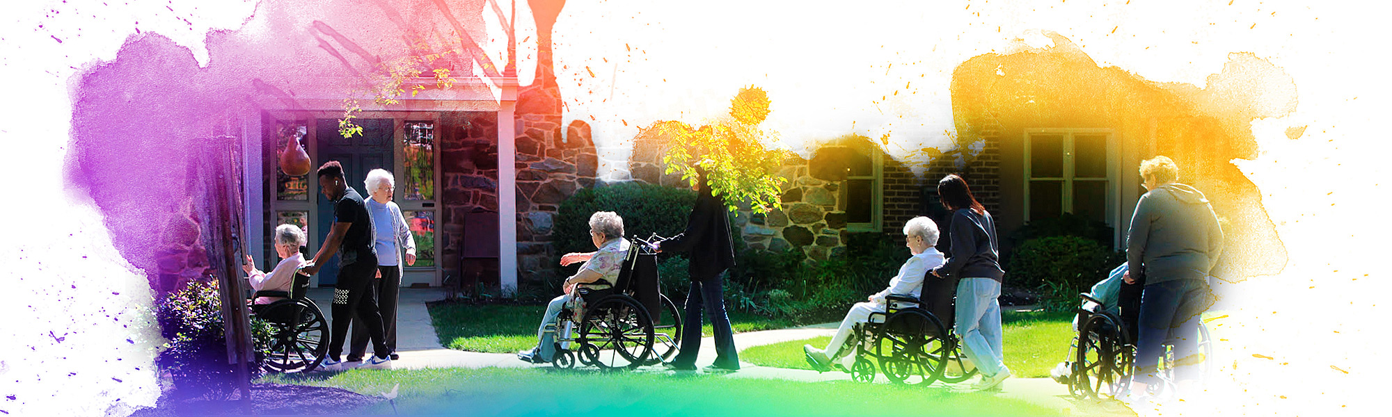 Volunteers helping by pushing residents in their wheelchairs