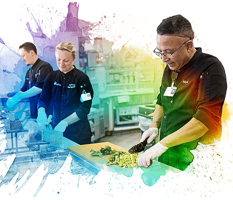 Three chefs working at the Bistro at Village Center