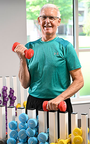 Resident Keith lifting weights